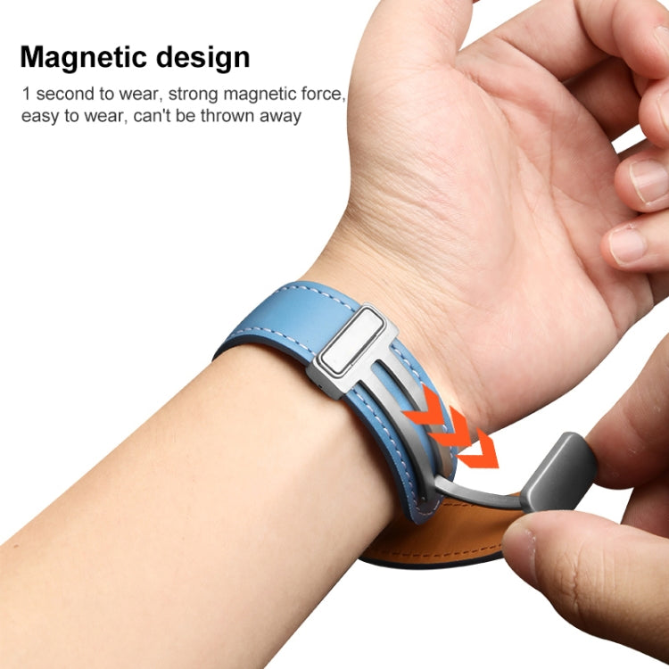 Blue genuine leather watch band with stitched edges and silver buckle on wrist