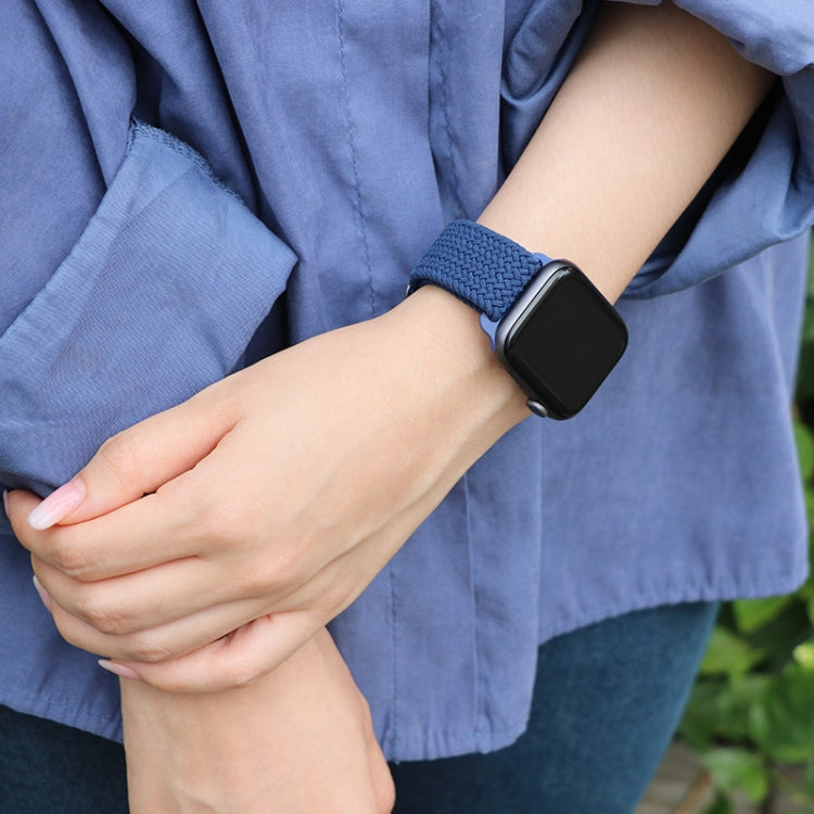 Blue nylon braided watch band with buckle on wrist