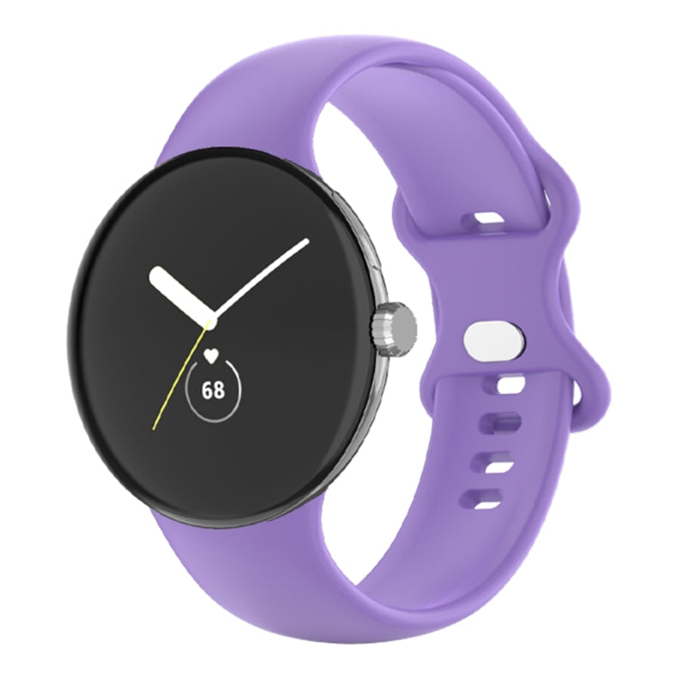 Purple silicone watch band with perforated holes and clasp, shown on a round watch case.