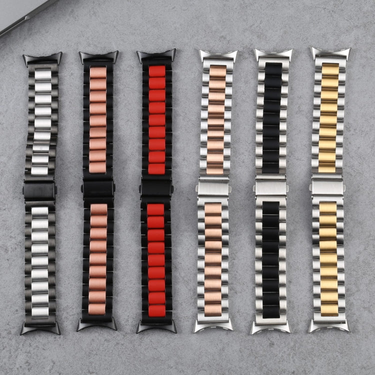 Mixed-color three-strand metal watch bands laid out, including silver, red, and black
