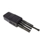 Black signal jammer unit with four antennas extending from the front panel.