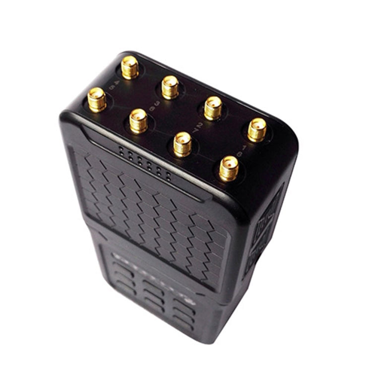Black signal jammer top with multiple gold connectors around the antenna base.