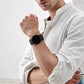 Black nylon loop watch band worn on wrist with metal clasp