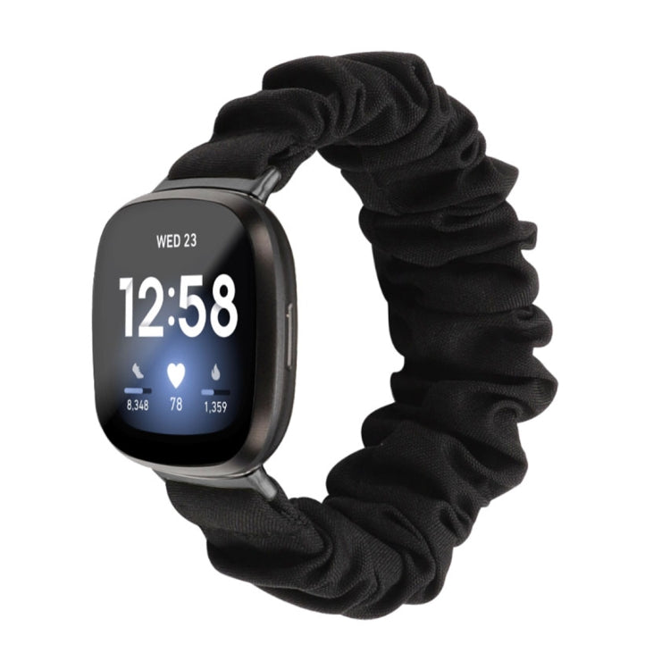 Solid black cloth scrunch watch band for smart watch; smartwatch shown.