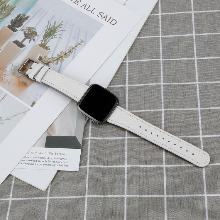 White leather smartwatch band with perforated strap holes and metal clasp.