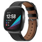 Black genuine leather watch band with stitched holes and silver buckle for smartwatch.