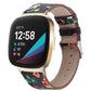 Black leather watch band with multicolor rose print, stitched holes, and silver buckle.