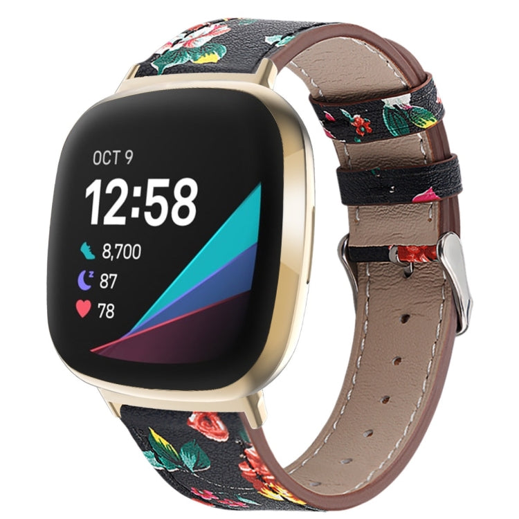 Black leather watch band with multicolor rose print, stitched holes, and silver buckle.