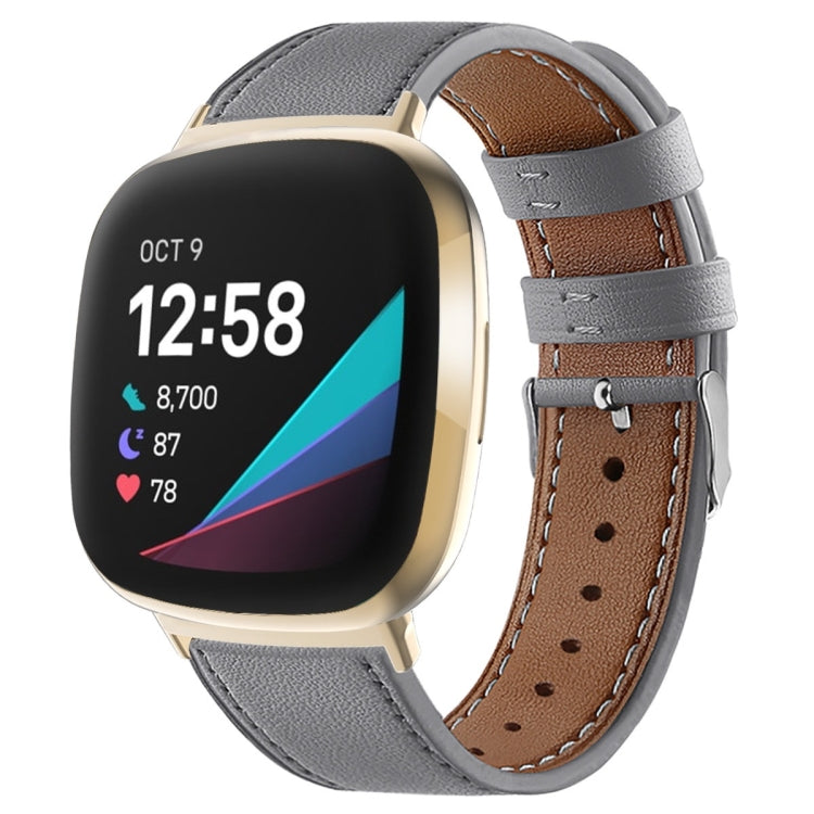 Gray leather watch band with stitched holes and silver buckle for smartwatch.