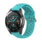 Mint green silicone sport watch strap with perforated holes and metal clasp for secure fit