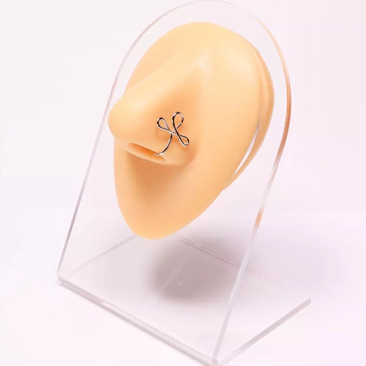 Flesh-colored silicone ear model with decorative dangling earring.