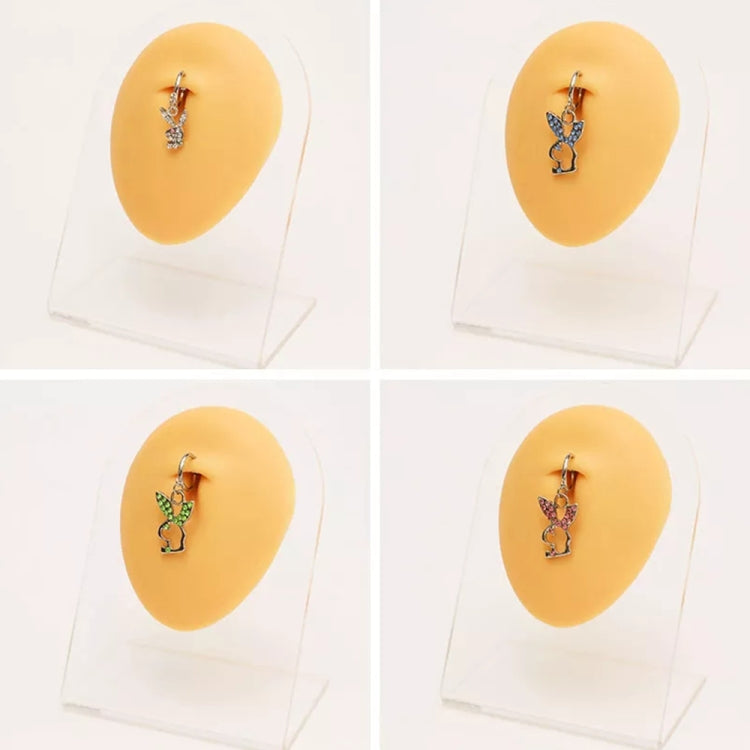 Set of flesh-colored silicone ear models with decorative earrings on stands.