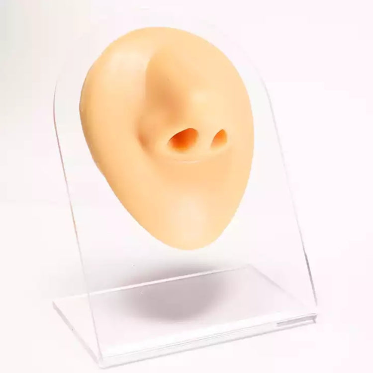 Flesh-tone silicone feature insert with two orange-tinted openings