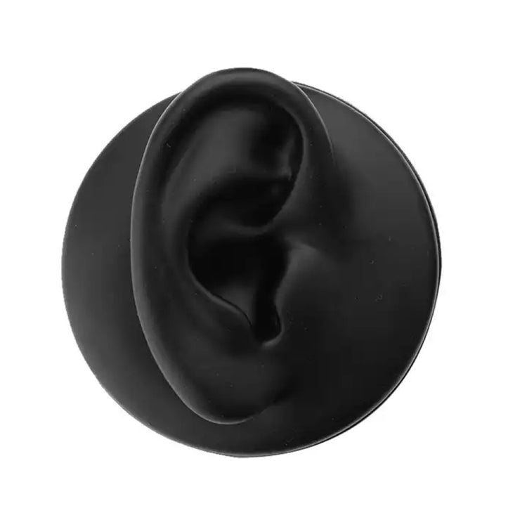 Black silicone ear model with inner ear detail.