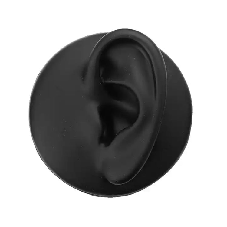 Black silicone ear model with inner ear detail, side view.