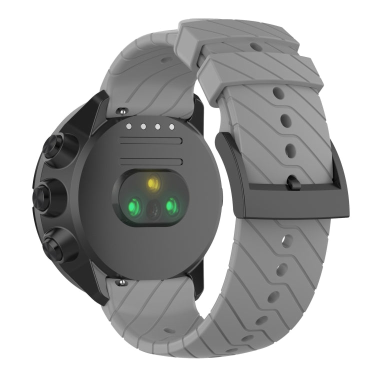 Grey silicone watch strap with textured segments and metal buckle