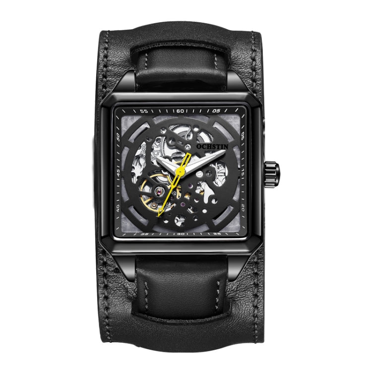 Black skeleton mechanical watch with black leather strap and yellow accented hands
