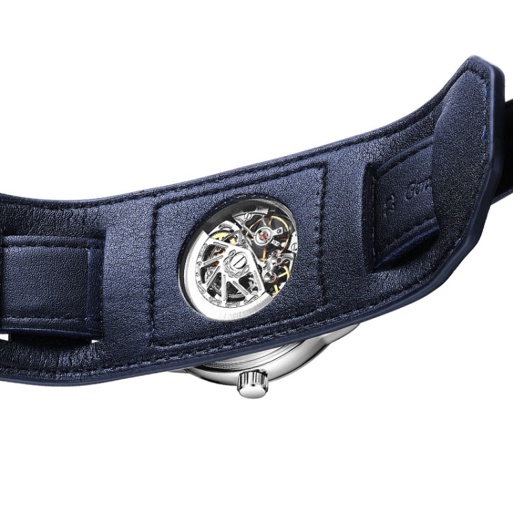 Blue leather wristwatch strap with metal case edge and skeleton dial detail