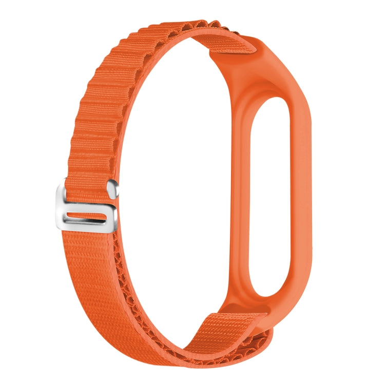 Orange nylon loop watch band with silver metal buckle and adjustable fit.