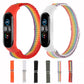 Two rainbow nylon loop watch bands, orange and starlight white, with attached trackers.
