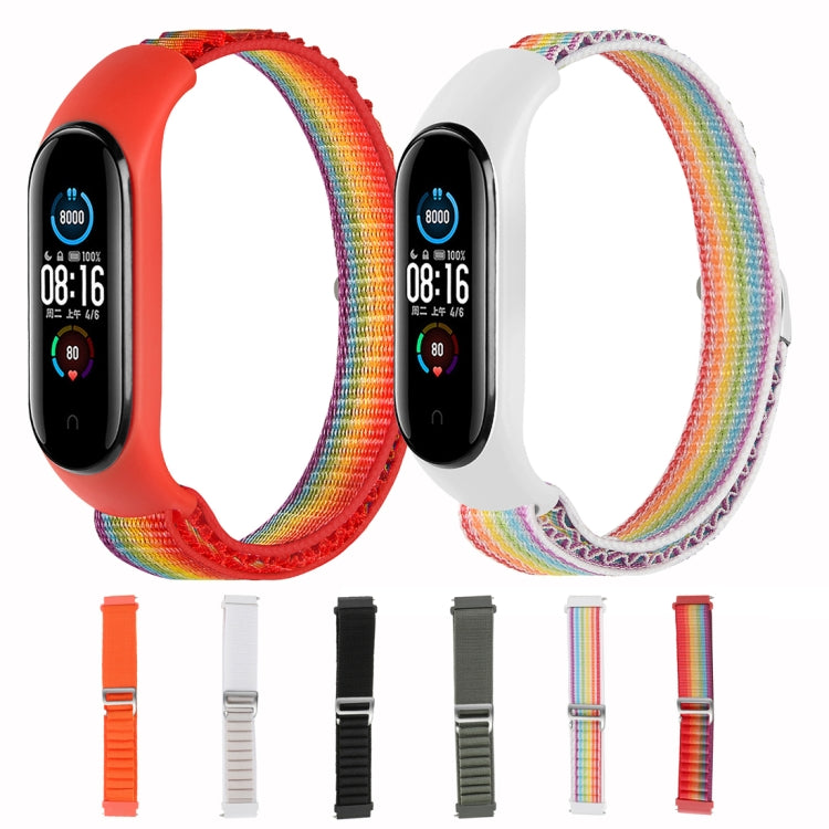 Two rainbow nylon loop watch bands, orange and starlight white, with attached trackers.