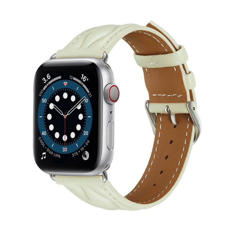 Light cream leather Apple Watch strap with tan underside and metal buckle.