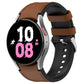 Silicone watch band with metal buckle, brown strap and black watch side.