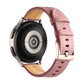 Pink fluted leather watch band with metal buckle and stitched holes, tan lining.