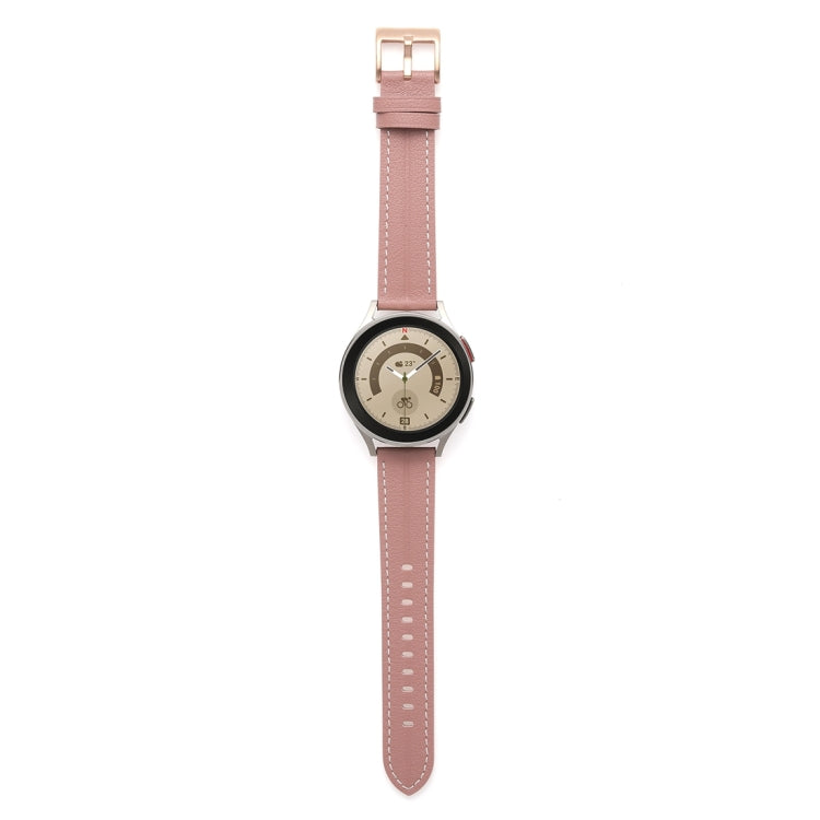 Light pink fluted leather watch band with stitched holes and metal buckle.