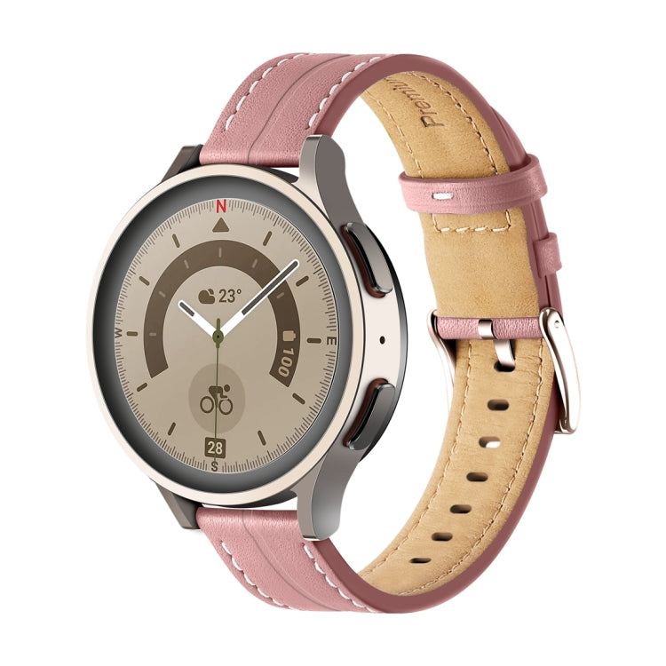 Pink fluted leather watch band with stitched holes and buckle, tan underside.