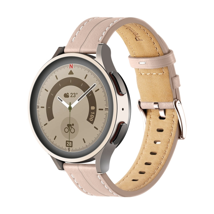 Pink fluted leather watch band with stitched holes and metal buckle, tan lining.