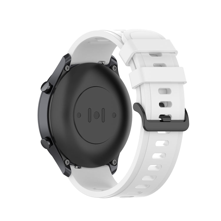 Black watch case with white silicone strap and quick release clasp, back view