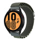 Green nylon watch band with metal clasp, shown with a smartwatch display
