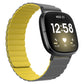 Silicone magnetic watch band, yellow with gray clasp, on a smartwatch with black display