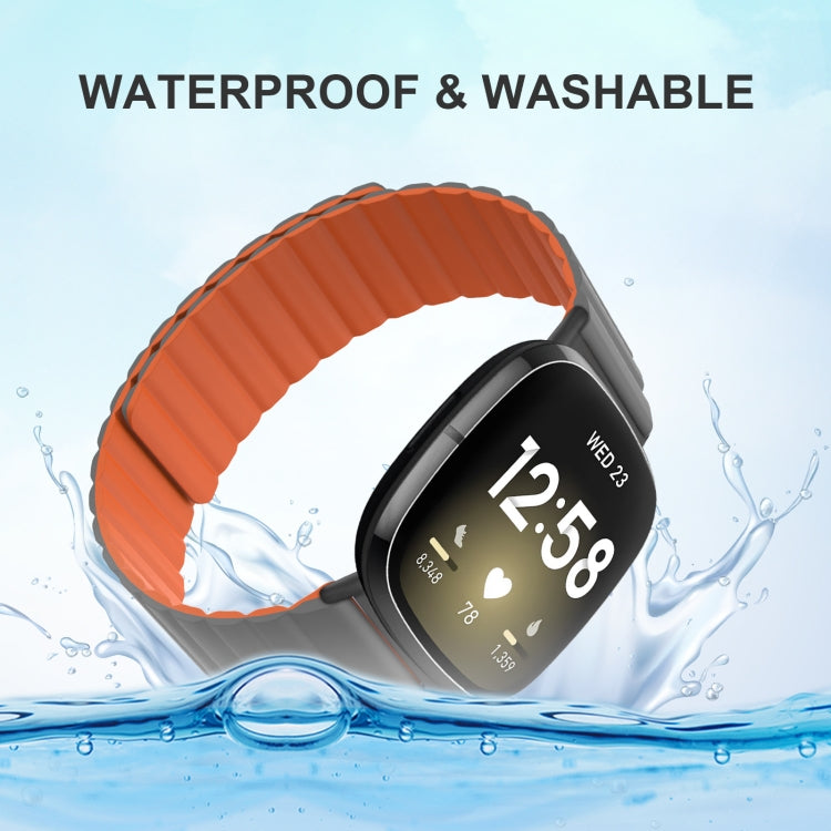 Orange magnetic silicone watch band with ribbed strap and metal buckle