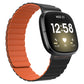 Orange silicone magnetic watch band with ridged strap and black clasp end.
