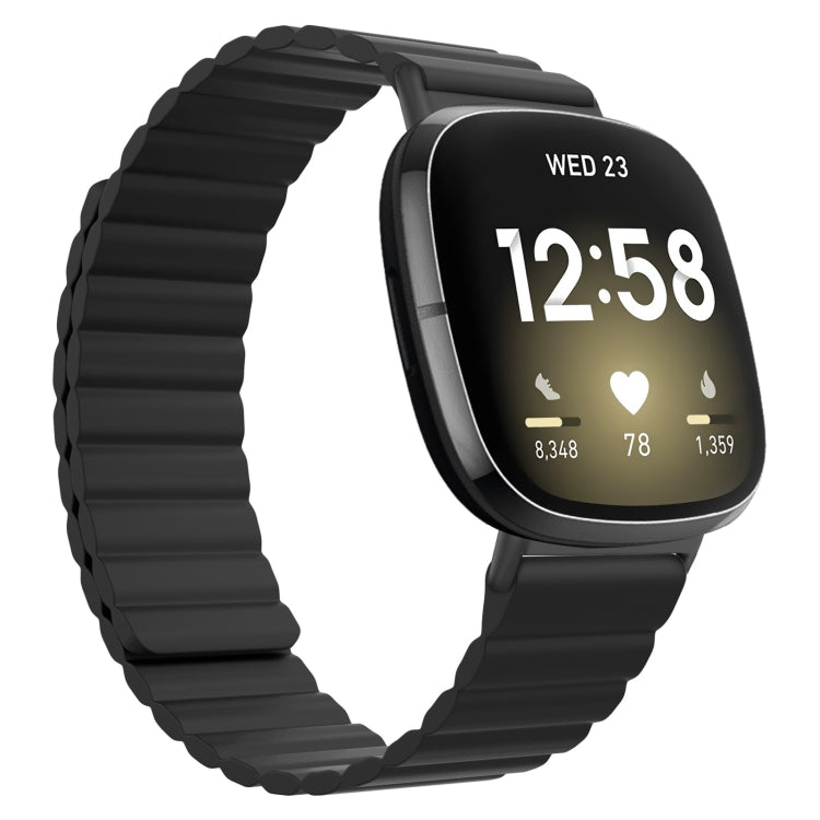 Black silicone magnetic watch band with ridged strap and black clasp end.