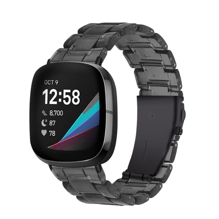 Black resin link watch band with stepped molded links, angled view on smartwatch