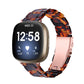 Tortoise-shell resin watch band with metal-toned clasp and sculpted links for Fitbit Versa