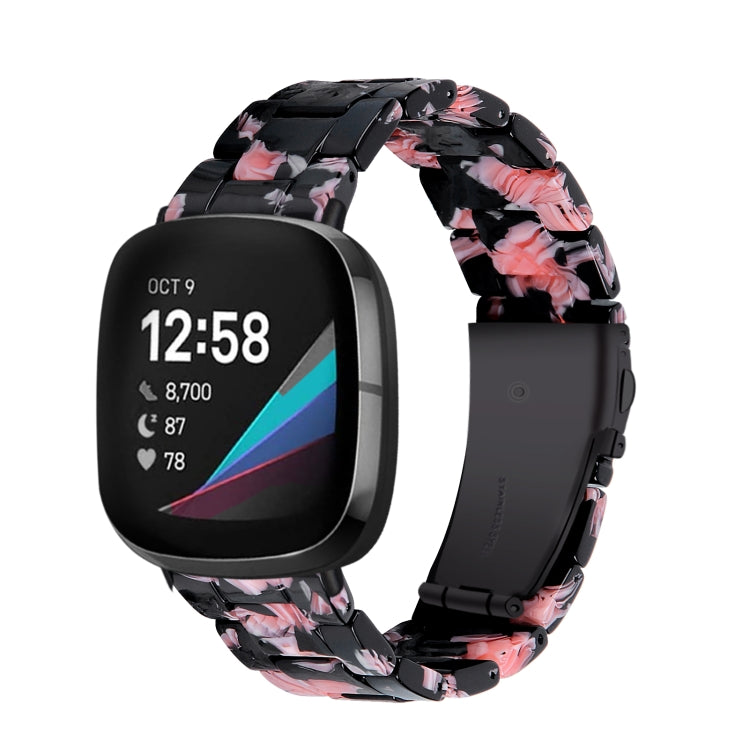 Black resin watch band with pink blossoms and molded link design, compatible with Fitbit Versa