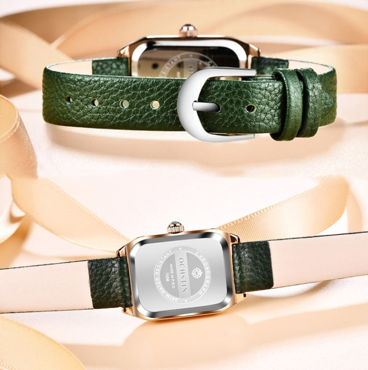 Green leather strap quartz watch with silver-tone buckle and caseback view