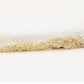 Beige cotton tassel lace trim ribbon showing smooth braided backing edge
