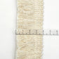 Beige cotton tassel lace trim ribbon with measuring ruler for width indication