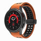 Orange silicone watch band with double-row holes and fold-over buckle, black clasp.