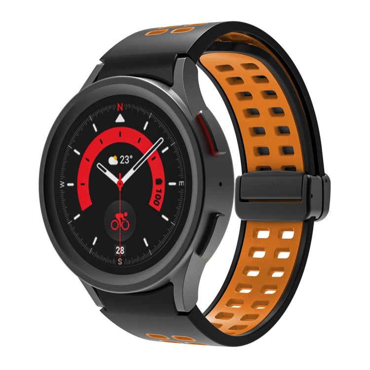 Orange and black silicone watch band with double-row holes and fold-over buckle.
