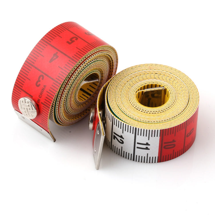 Two coiled measuring tape rolls with metal clips, red and white scales