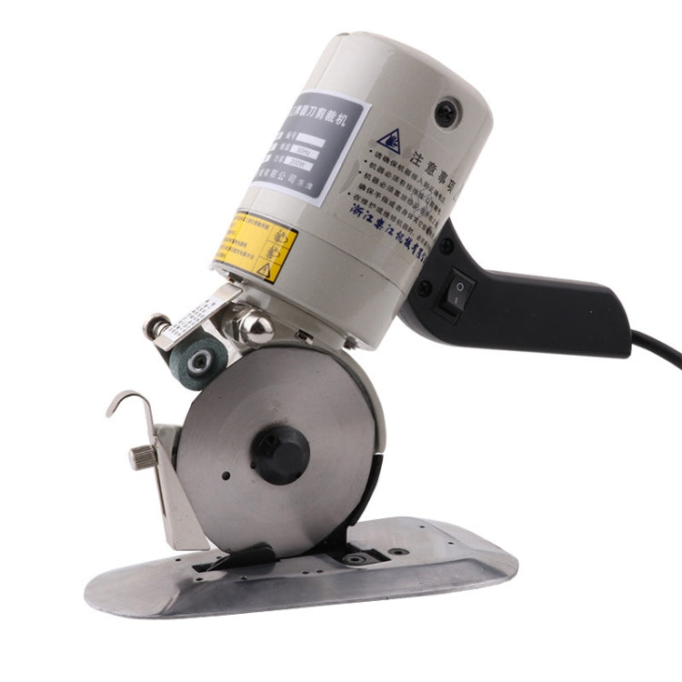 Electric fabric cutter showing 90mm circular blade and black trigger-style handle