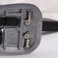 Electric cutter head close-up with metal guard, mounting bolts and blade holder