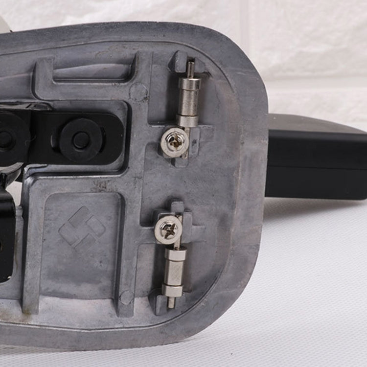 Electric cutter head close-up with metal guard, mounting bolts and blade holder