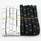 Polyester size labels roll with black and white tape, XS–5XL printed